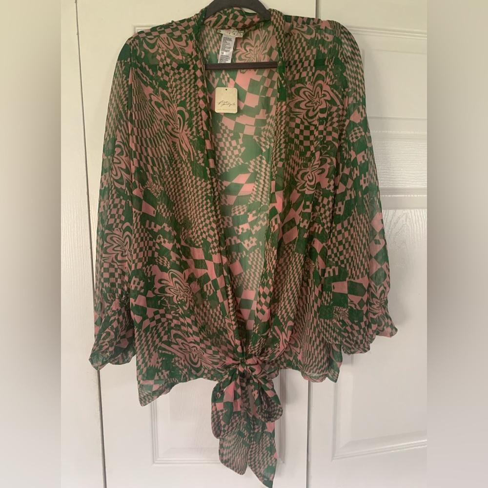 Free People all size wrap. Sleeves are billowy  then end in 3” cuff. Ties front.